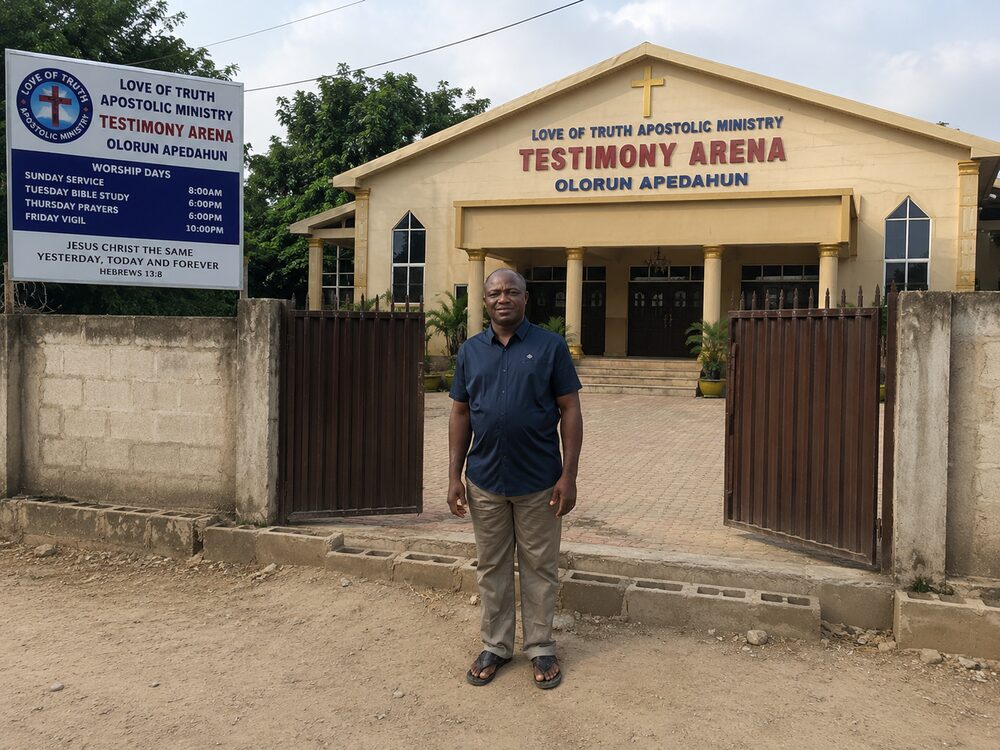 Owolabi Oluwasegun at the roadside entrance of Testimony Arena