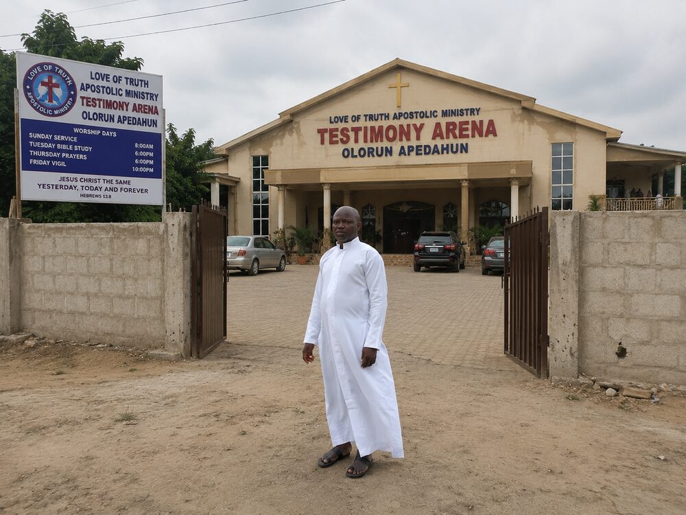 Owolabi Oluwasegun outside Testimony Arena before a worship service